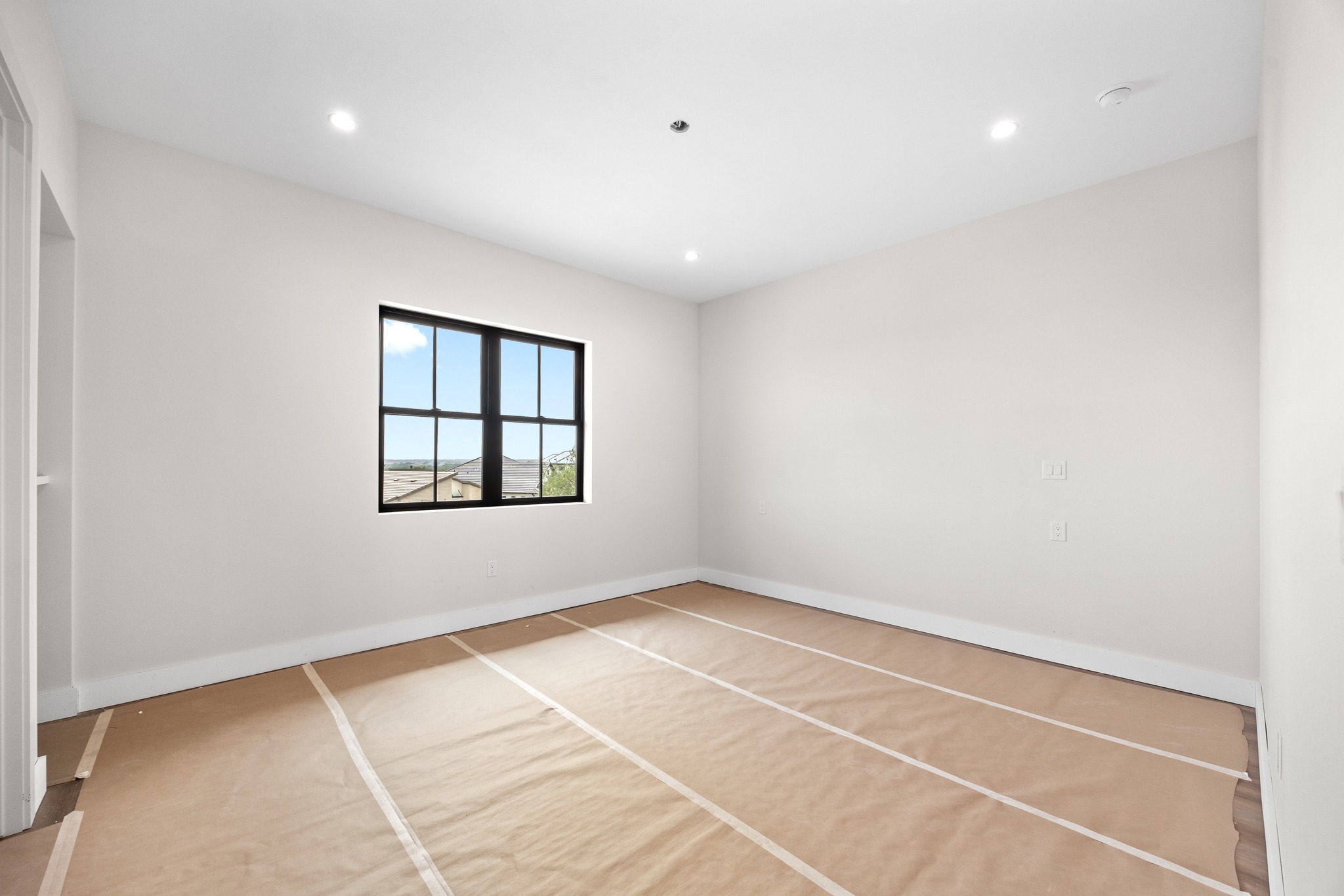 903 Flint Ridge Trail Georgetown, TX 78628 - Photo 28 of 39 Room featuring white walls, recessed lighting, and a black-framed window