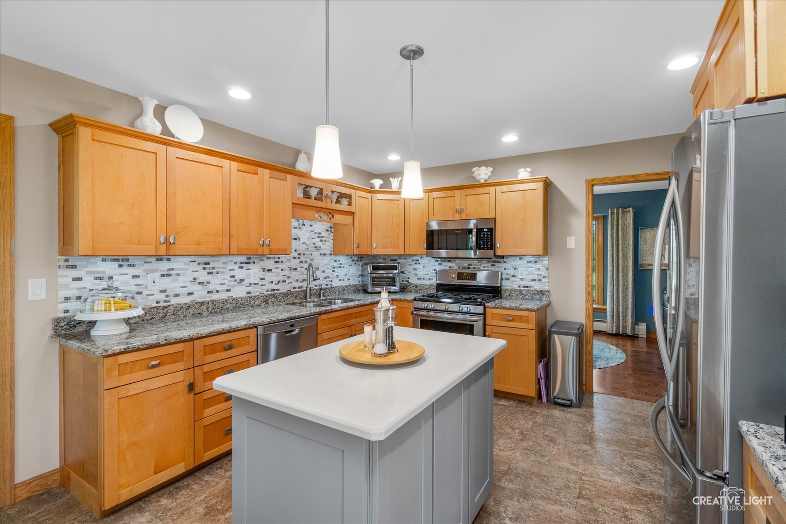 14050 Townhouse Road Newark, IL 60541 - Photo 11 of 45 a kitchen with stainless steel appliances granite countertop a sink a stove and a refrigerator
