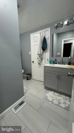 a room with a couch and a flat screen tv