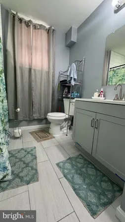 a view of room with a mirror and a sink