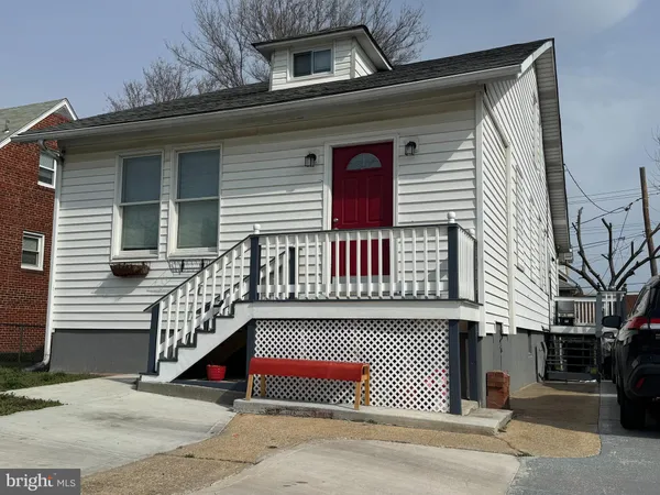 a view of a white house with a large windows