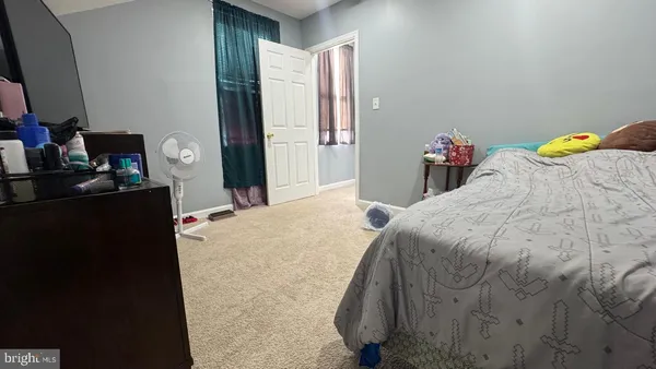 a view of a storage and utility room with closet