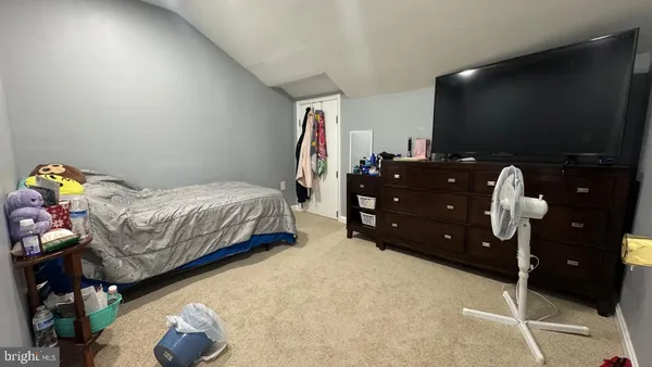 a living room with lots of furniture and kitchen view