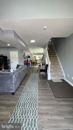 a room with pool table and windows