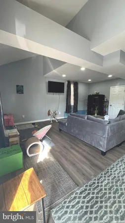 a living room with furniture and a rug