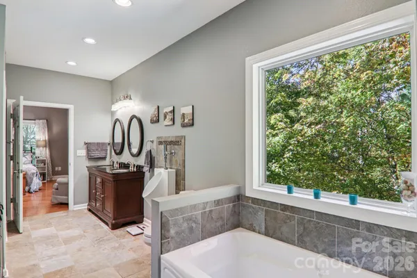 a kitchen with stainless steel appliances granite countertop a sink and a stove