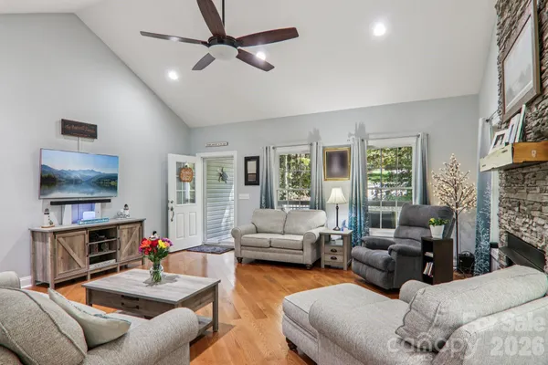 a living room with furniture and a flat screen tv