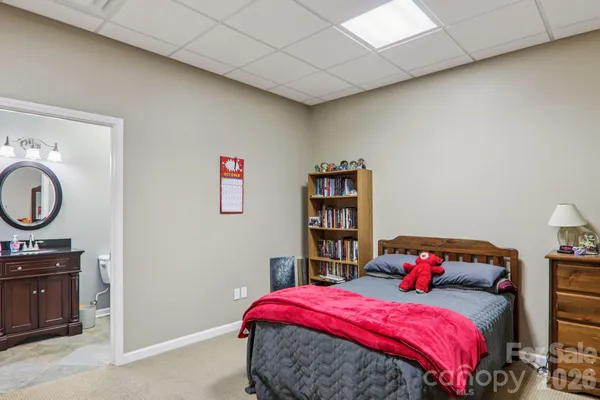 a bedroom with a bed and cabinets