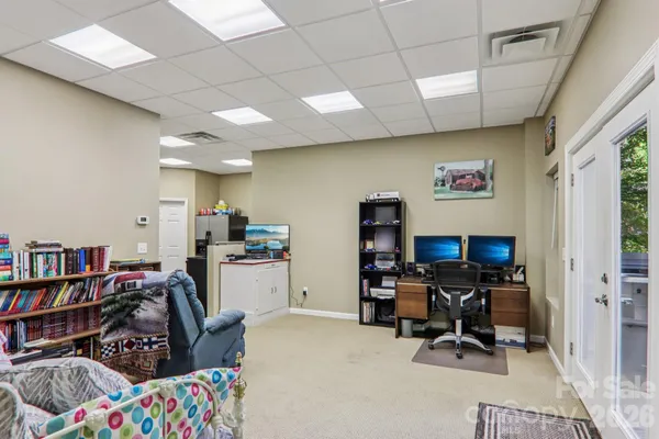 a view of a workspace with furniture