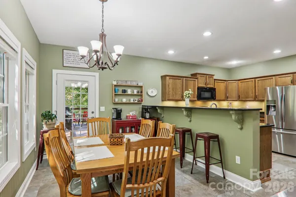 a view of a dining room with furniture window and outside view