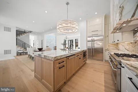 a kitchen with stove and refrigerator
