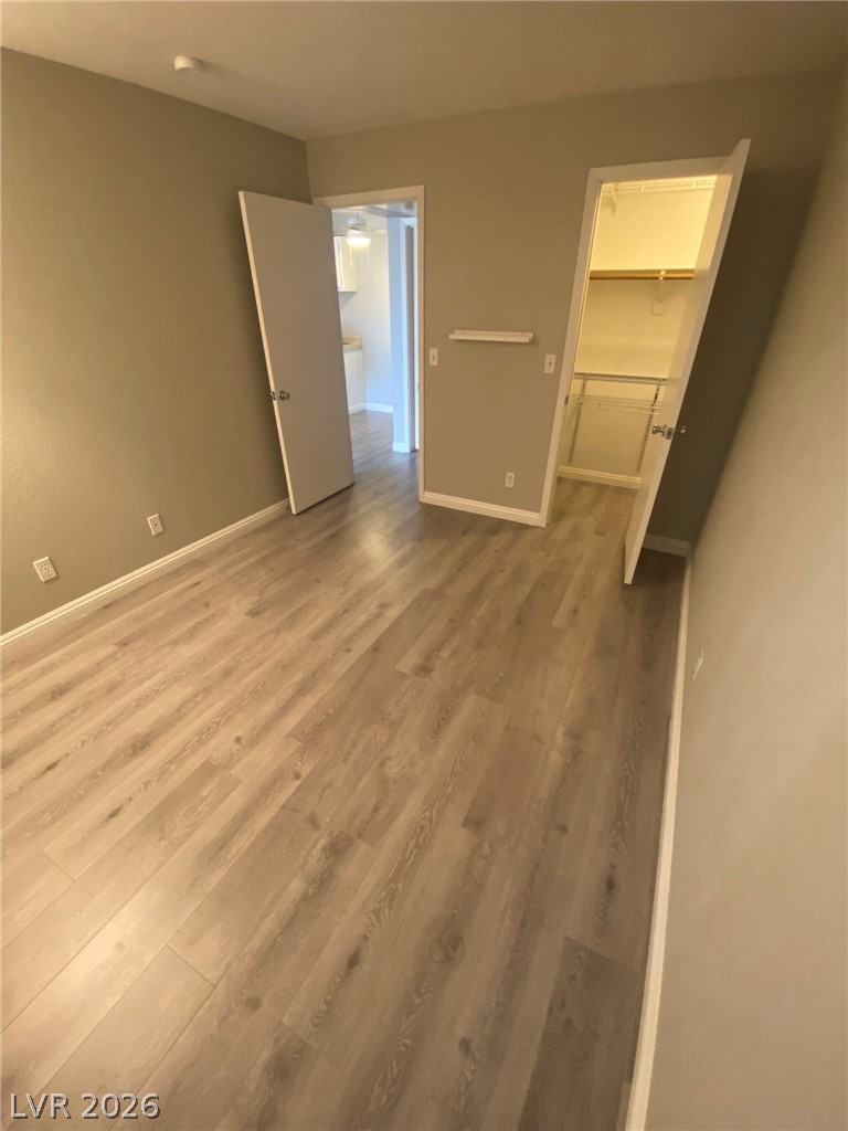 5271 South Lindell Road, Unit 202 Las Vegas, NV 89118 - Photo 21 of 27 Newly installed wood flooring creates a clean, inviting atmosphere for any future use.