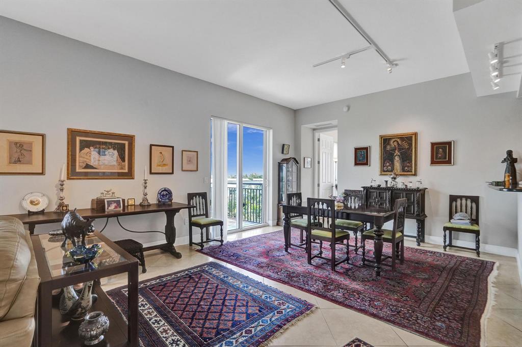 2633 Northeast 14th Avenue, Unit 400 Wilton Manors, FL 33334 - Photo 17 of 74 a living room with furniture a rug and a table