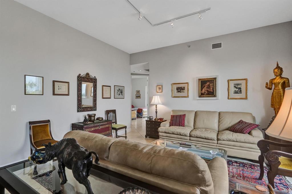 2633 Northeast 14th Avenue, Unit 400 Wilton Manors, FL 33334 - Photo 19 of 74 a living room with furniture and a couch