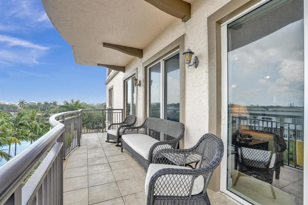 2633 Northeast 14th Avenue, Unit 400 Wilton Manors, FL 33334 - Photo 22 of 74 a balcony with furniture and a view of balcony