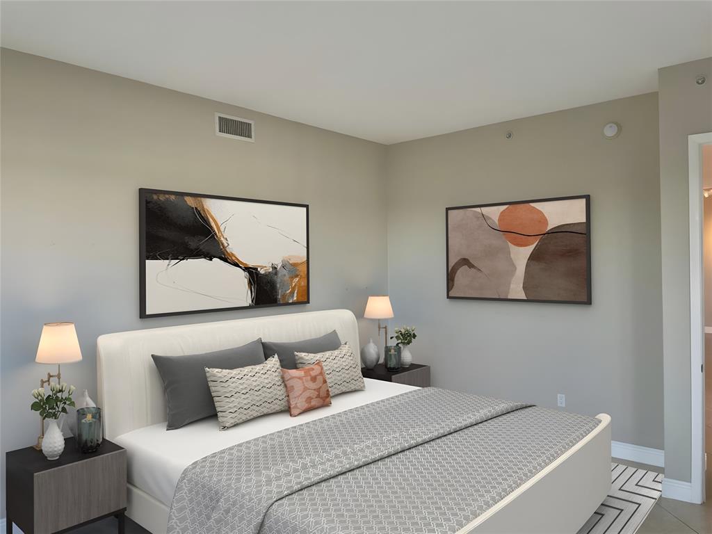 2633 Northeast 14th Avenue, Unit 400 Wilton Manors, FL 33334 - Photo 25 of 74 a bedroom with a bed and a painting on the wall
