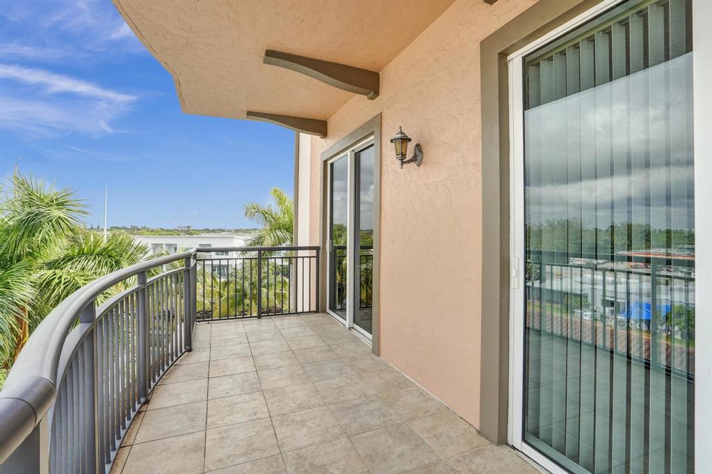 2633 Northeast 14th Avenue, Unit 400 Wilton Manors, FL 33334 - Photo 42 of 74 a balcony with a water view of outdoor space
