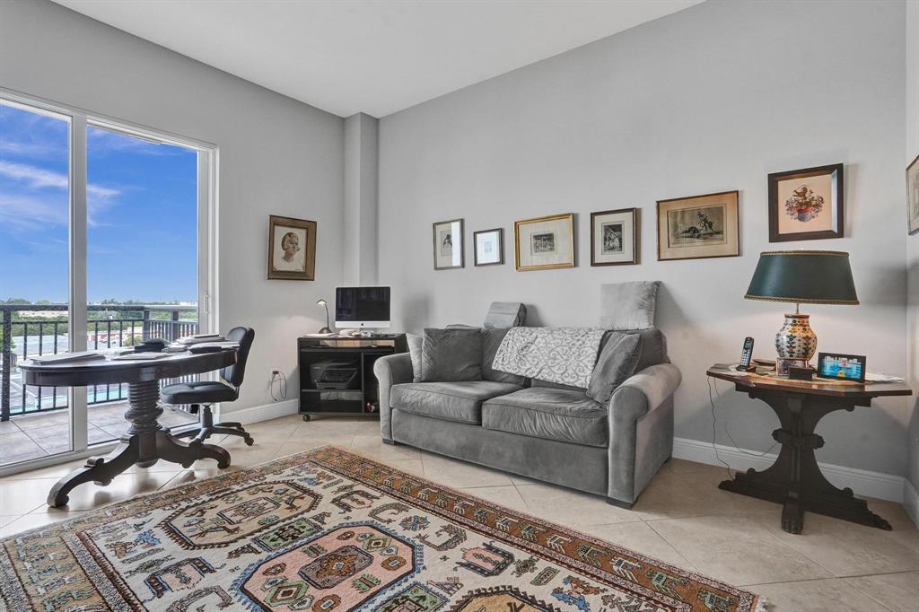 2633 Northeast 14th Avenue, Unit 400 Wilton Manors, FL 33334 - Photo 44 of 74 a living room with furniture and a piano