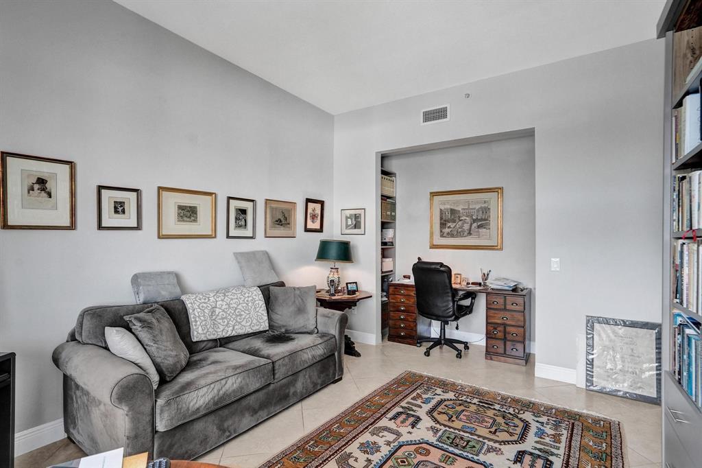 2633 Northeast 14th Avenue, Unit 400 Wilton Manors, FL 33334 - Photo 45 of 74 a living room with furniture and a window