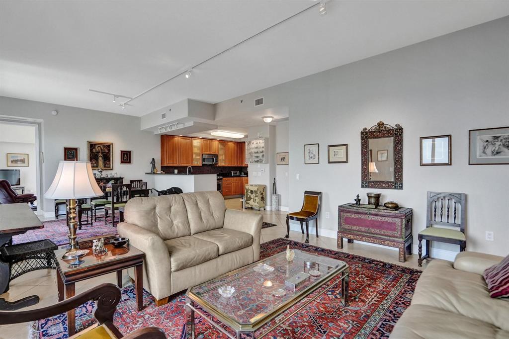 2633 Northeast 14th Avenue, Unit 400 Wilton Manors, FL 33334 - Photo 7 of 74 a living room with furniture and wooden floor