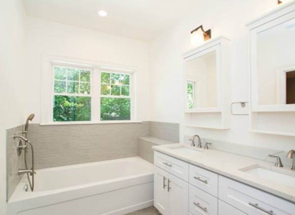 12 Suban Place, Unit 2 Newton, MA 02461 - Photo 11 of 13 a bathroom with a tub sink and mirror