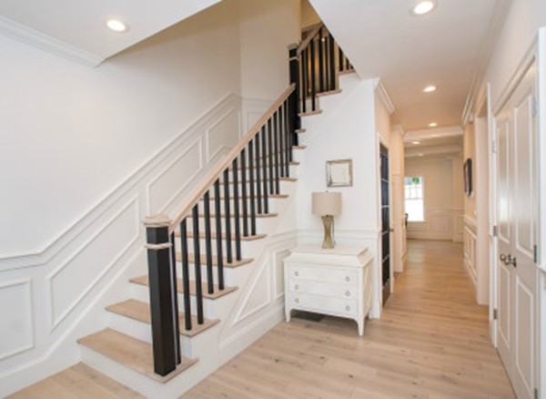 12 Suban Place, Unit 2 Newton, MA 02461 - Photo 6 of 13 a view of a hallway with staircase and white walls