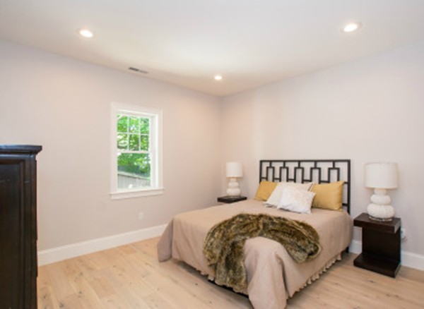12 Suban Place, Unit 2 Newton, MA 02461 - Photo 7 of 13 a large bed sitting in a bedroom next to a window