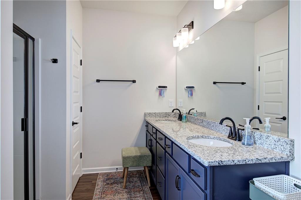 402 Perth Drive Cartersville, GA 30121 - Photo 23 of 31 a bathroom with a granite countertop sink and a mirror