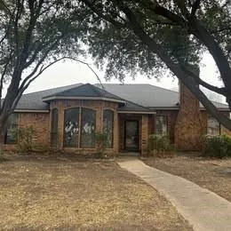 a front view of a house with yard