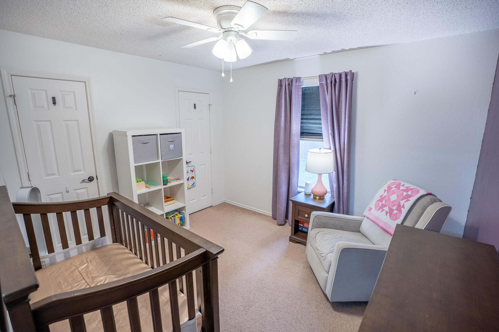1609 78th Street Lubbock, TX 79423 - Photo 25 of 36 a bedroom with furniture and a window