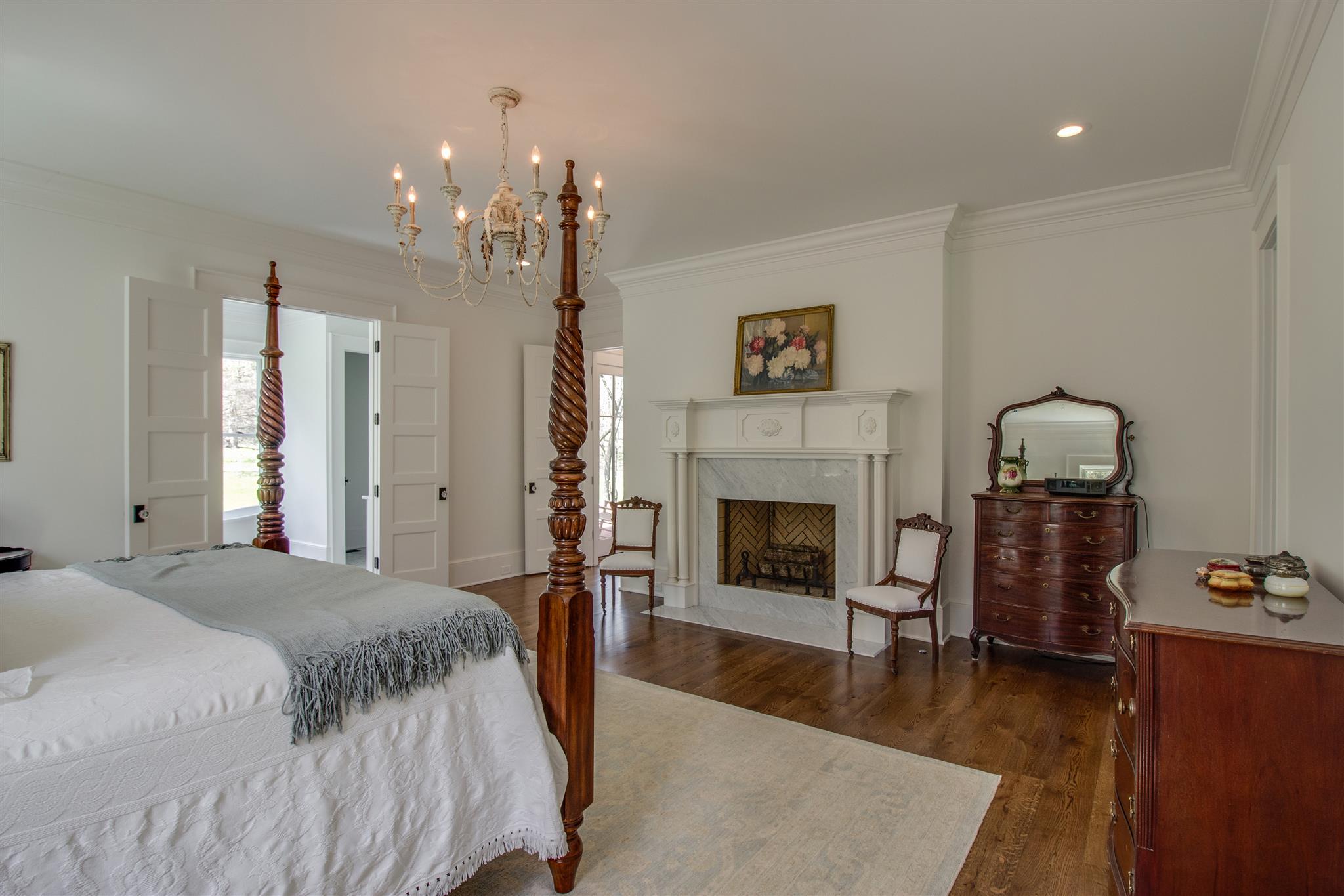 3533 Bailey Road Franklin, TN 37064 - Photo 17 of 29 a spacious bedroom with a bed and a fireplace