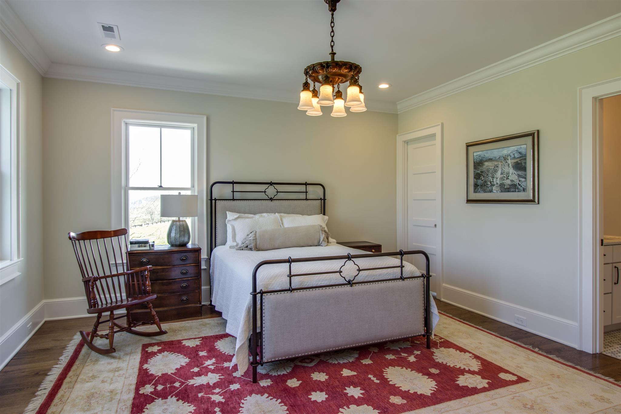 3533 Bailey Road Franklin, TN 37064 - Photo 24 of 29 a bedroom with a bed and a chandelier
