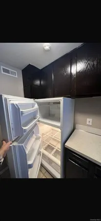 a view of kitchen and wooden floor
