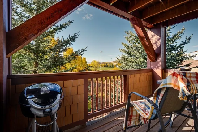 a view of a two chairs in the balcony