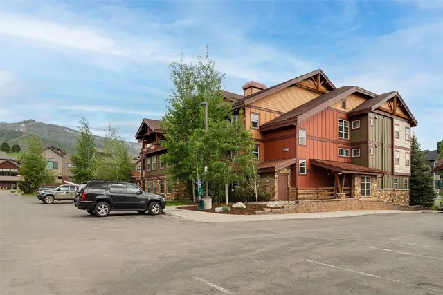 a view of a car parked in front of a building