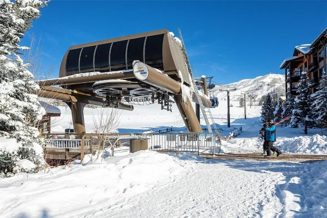 a view of a house with snow on the road