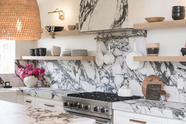 a kitchen with a stove and cabinets
