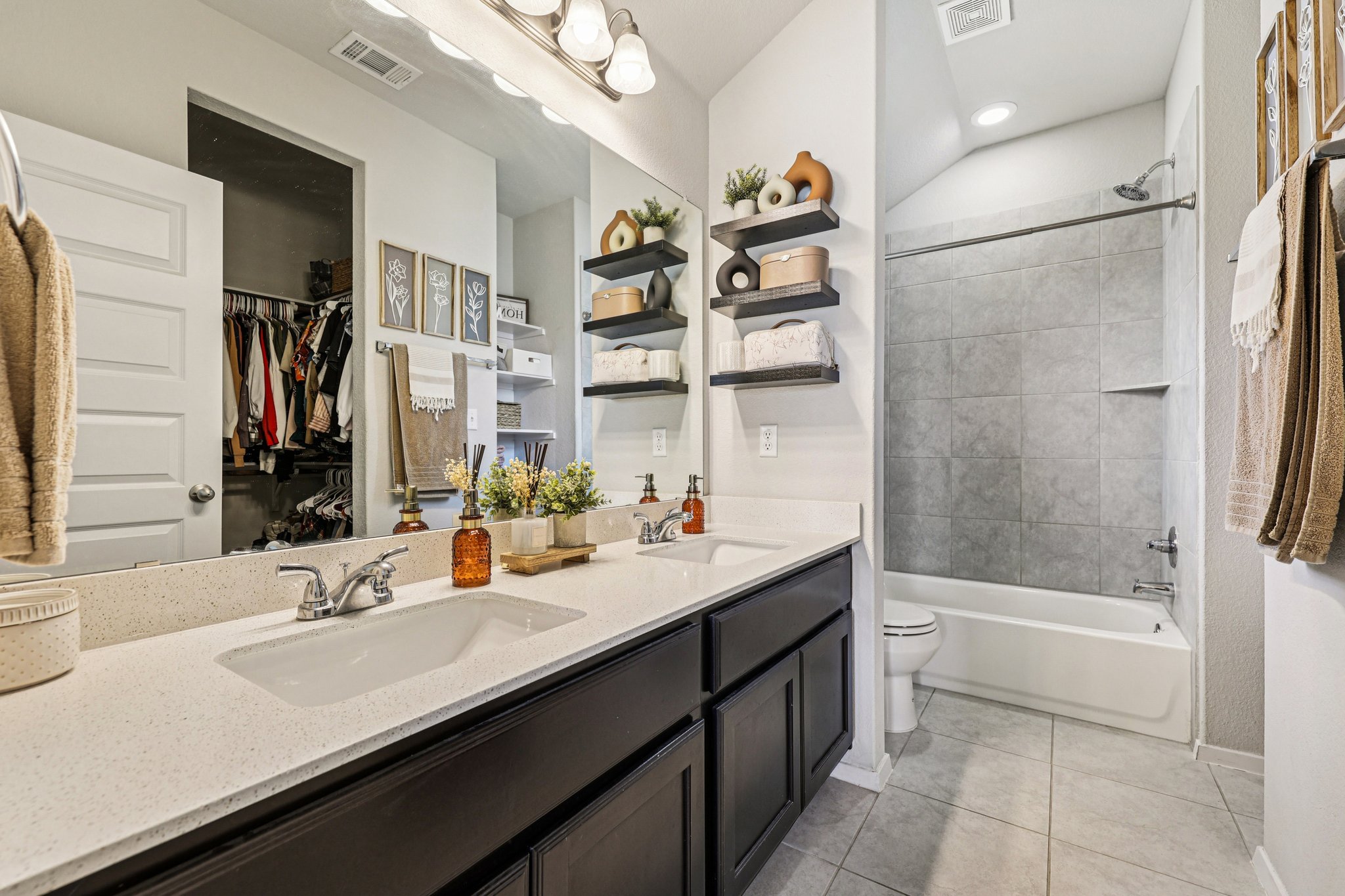 111 Insider Loop Elgin, TX 78621 - Photo 26 of 39 a bathroom with a sink double vanity granite tub shower and a mirror