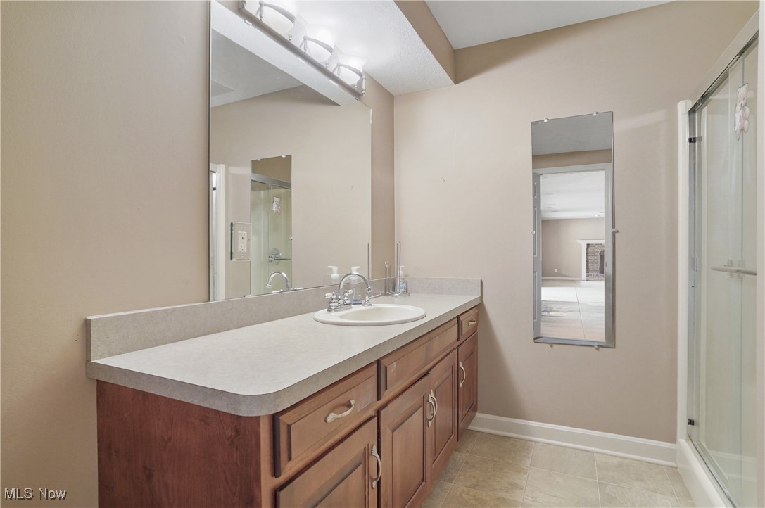 5952 Beach Road Wadsworth, OH 44281 - Photo 32 of 40 Bathroom with vanity, a shower stall, and ceramic tile flooring