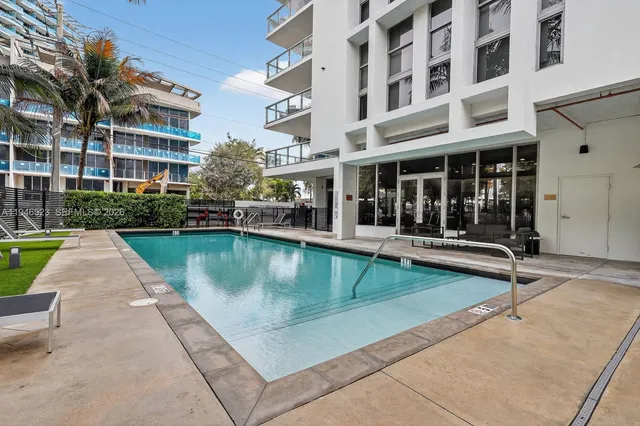front view of a building with a swimming pool