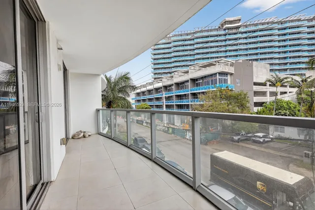 a view of balcony with potted plants