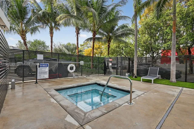 a view of outdoor space with swimming pool and lounge chair