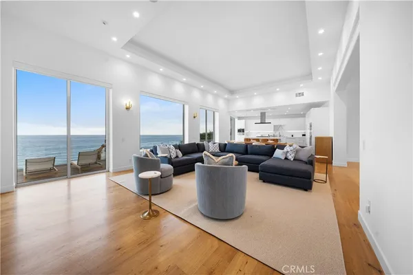 a dining room with furniture and a large window