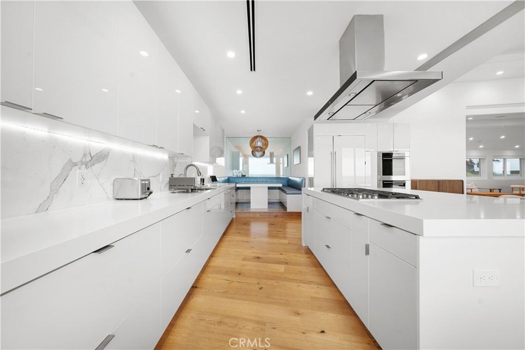31654 Broad Beach Road Malibu, CA 90265 - Photo 19 of 75 a large kitchen with kitchen island lots of counter space a sink and a large window
