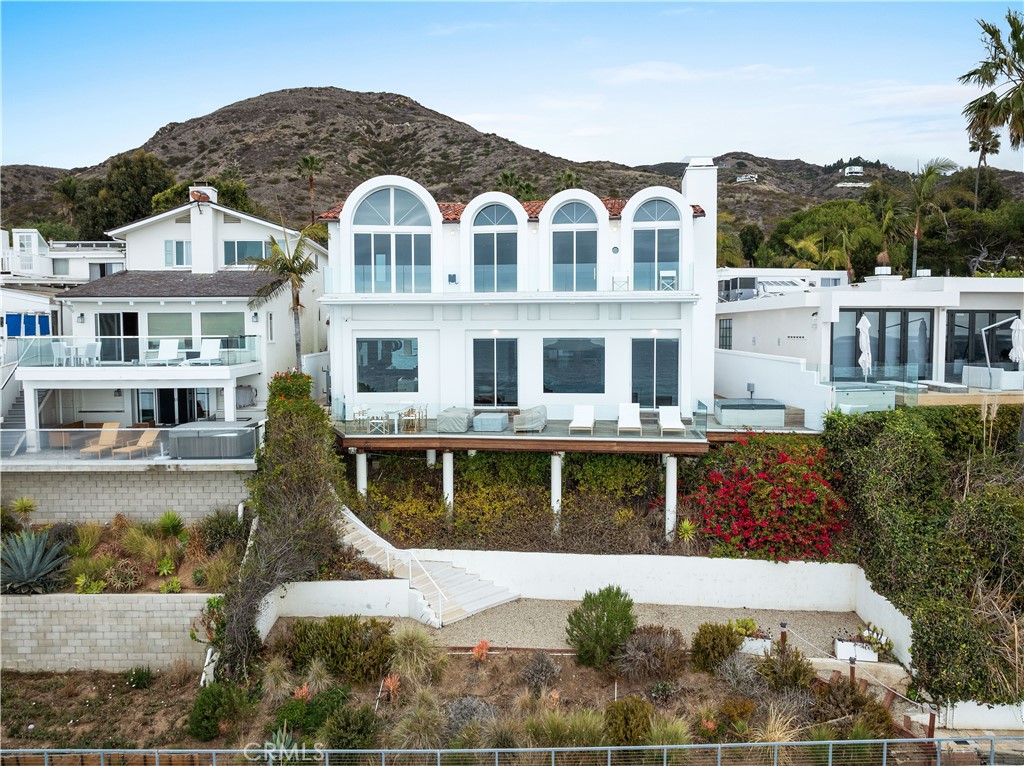 31654 Broad Beach Road Malibu, CA 90265 - Photo 2 of 75 a front view of a residential apartment building with a yard