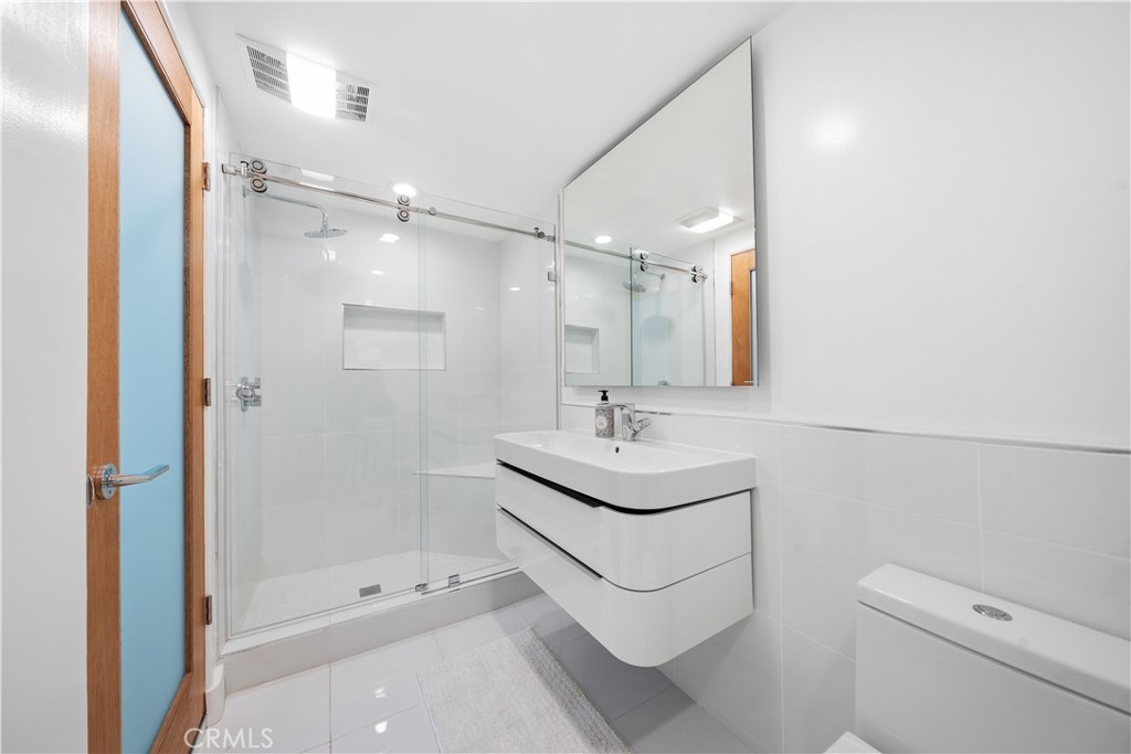 31654 Broad Beach Road Malibu, CA 90265 - Photo 27 of 75 a bathroom with a sink a toilet and shower