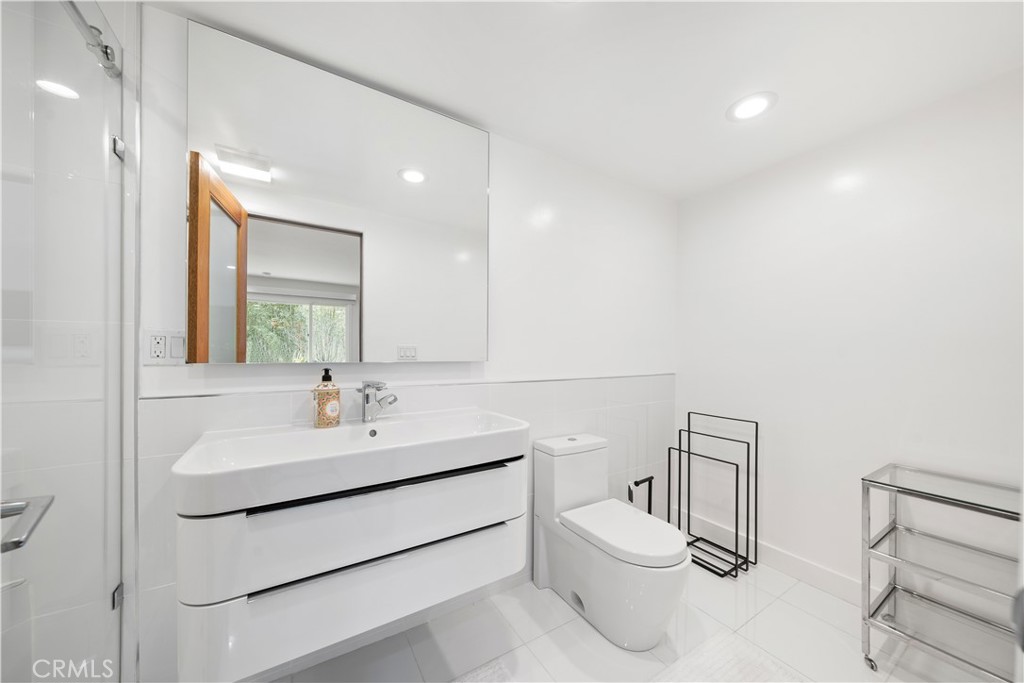 31654 Broad Beach Road Malibu, CA 90265 - Photo 28 of 75 a bathroom with a sink toilet and a mirror