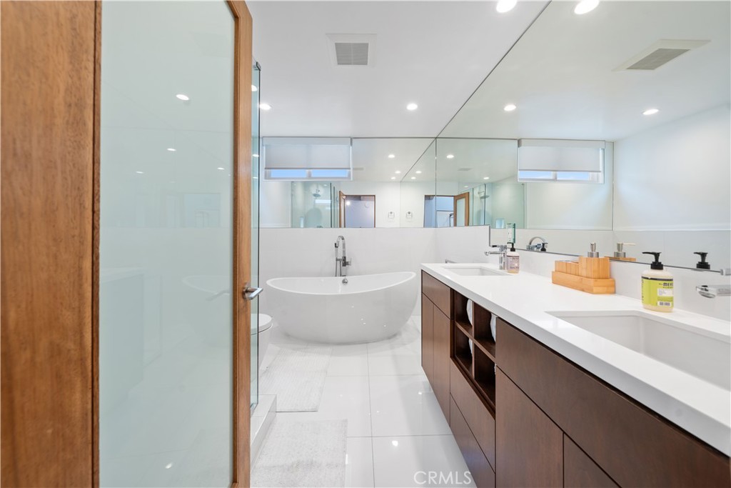31654 Broad Beach Road Malibu, CA 90265 - Photo 31 of 75 a large bathroom with a double vanity sink mirror and bathtub