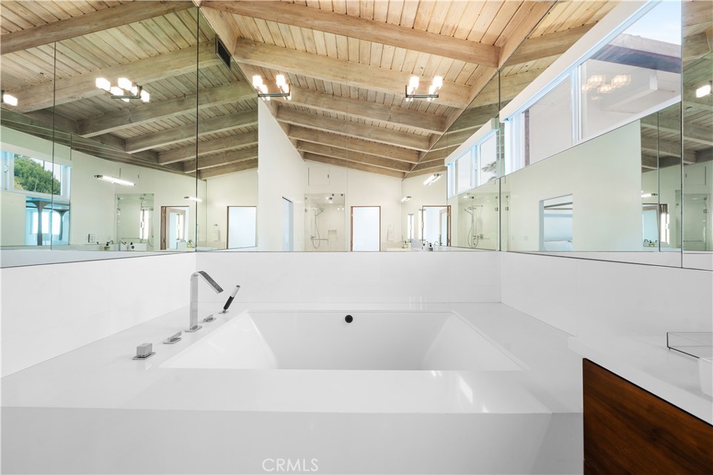 31654 Broad Beach Road Malibu, CA 90265 - Photo 32 of 75 a bathroom with a bathtub and a sink
