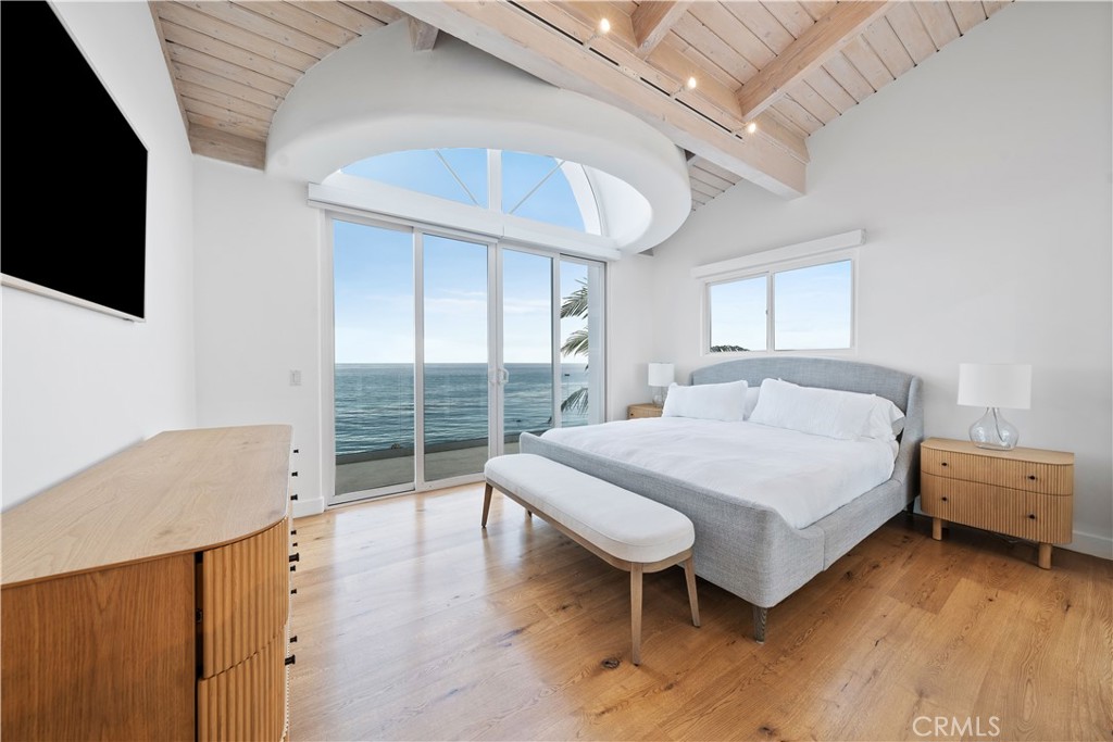 31654 Broad Beach Road Malibu, CA 90265 - Photo 36 of 75 a bedroom with a bed and a flat tv screen on the dresser